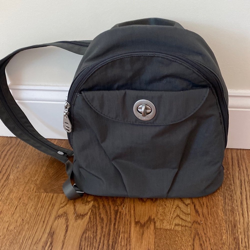 Grey nylon back pack purse /sling bag.